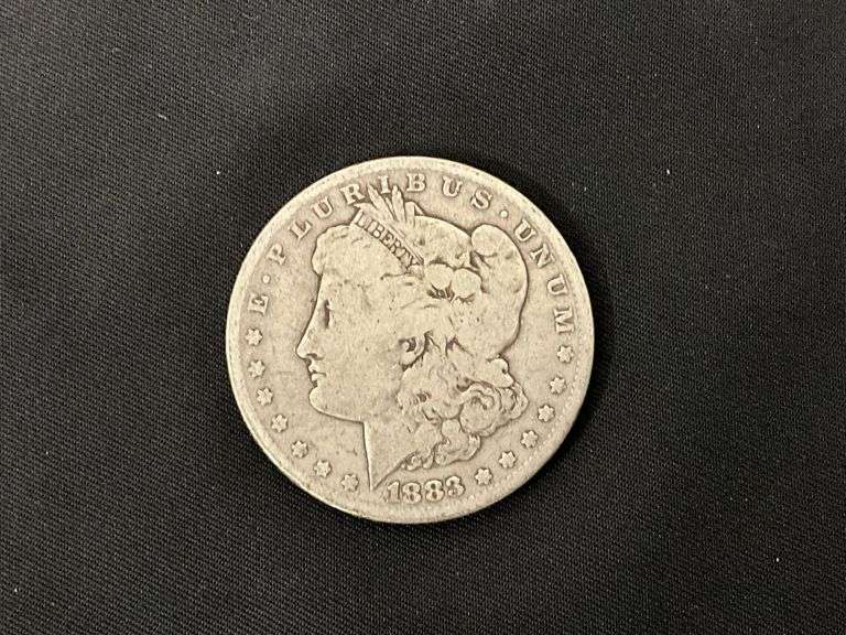 1883 Morgan silver dollar image
