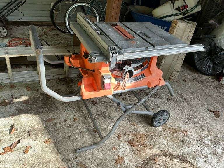 Ridgid table saw, roll around portable stand image