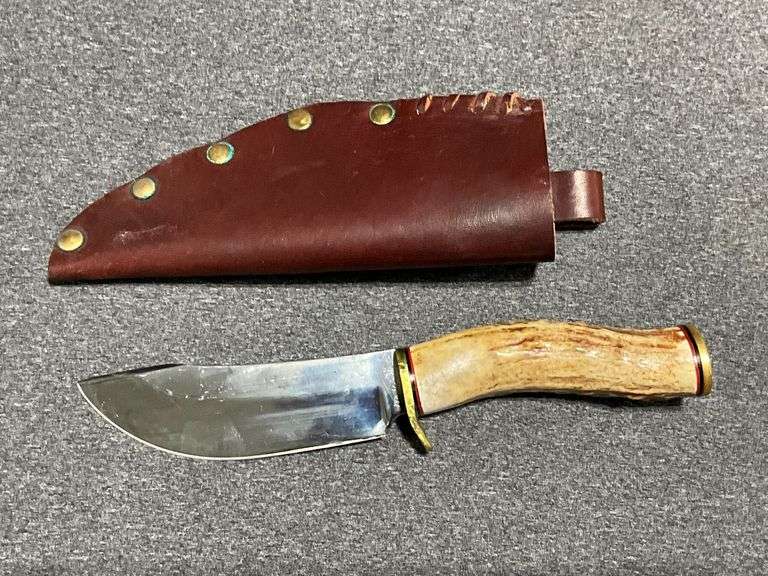 Handmade knife with non-matching leather sheath image