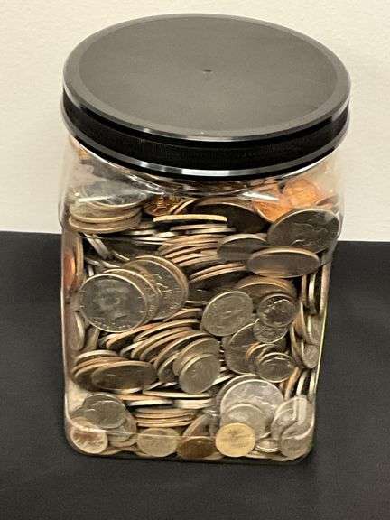 Plastic jar FULL of coins image