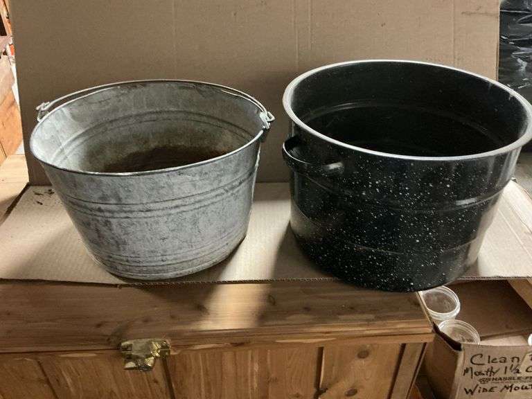 Galvanized bucket with hole in bottom image