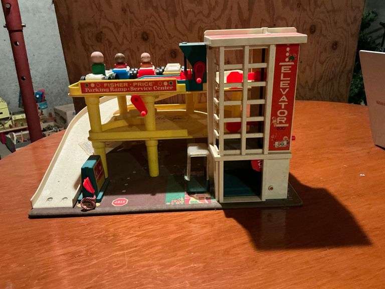 Fisher-Price Parking Ramp Service Center with cars and people image