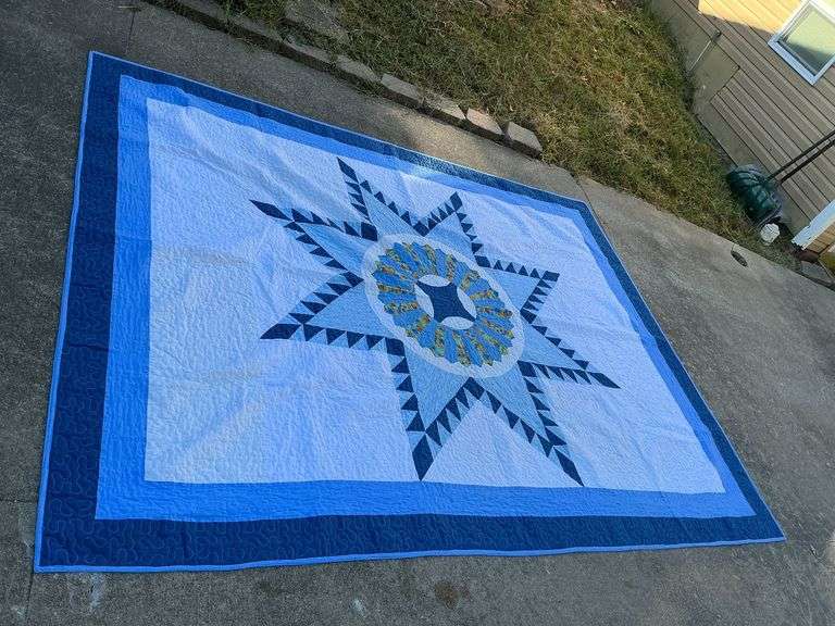 Machine quilted medallion quilt, some stains image