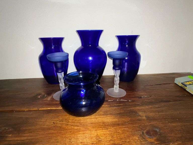 Blue vase and blue and clear candle sticks image