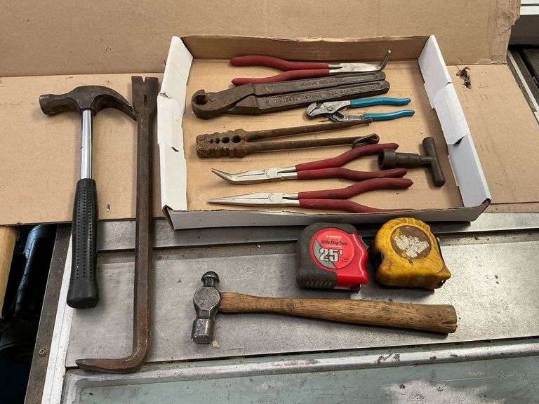 Needle nose pliers, cutters, hammer, crow bar, tape measure, etc. image