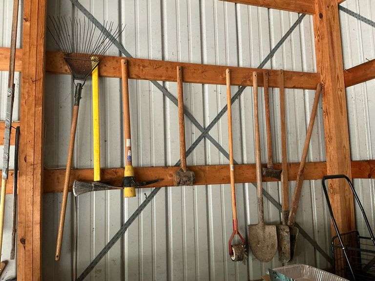 Splitting maul, post hole digger, pick image