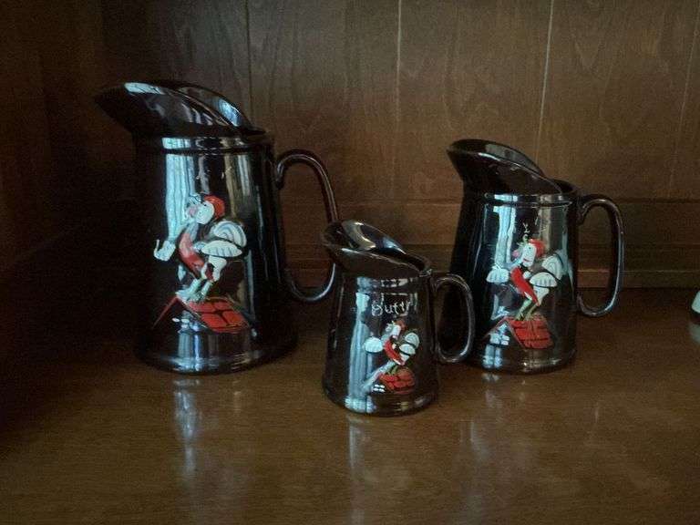 Set of 3 brown pitchers with rooster motif image