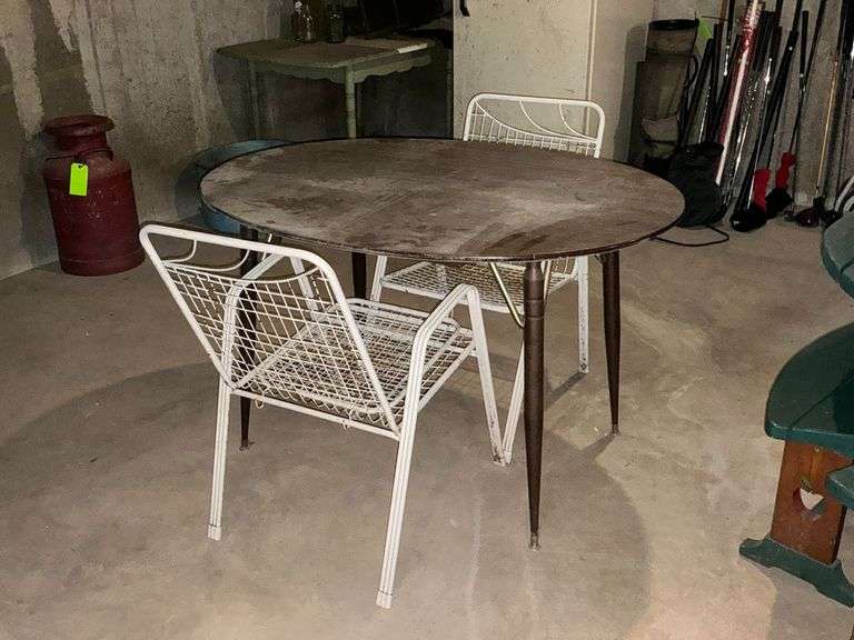 Oval kitchen table with pair of lawn chairs image