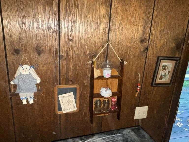 Decorative items, wooden sleigh shelf, glass insulators, swinging rabbit, etc. image