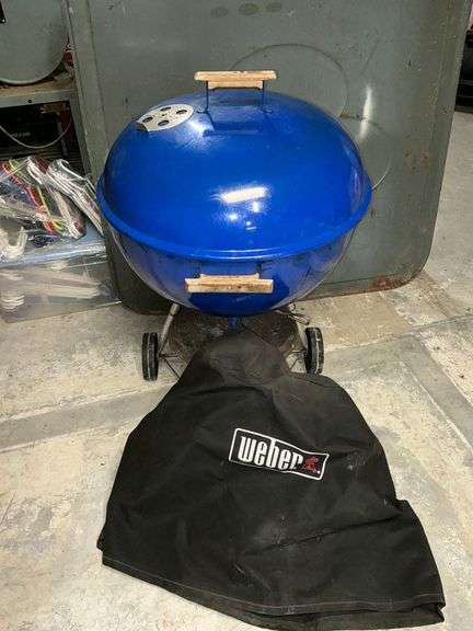 Weber charcoal grill with cover image