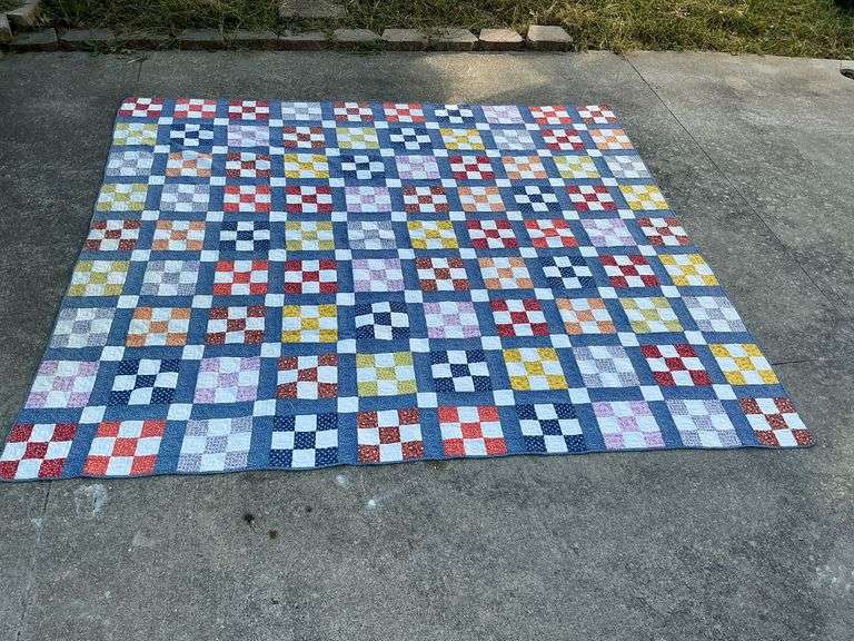 9 patch machine quilted, some stains image