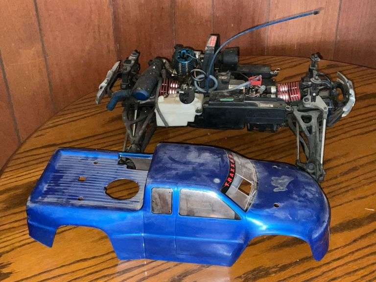 Radio Control Traxxas 4-wheel drive truck chassis, 2-cylinder motor, radio receiver image