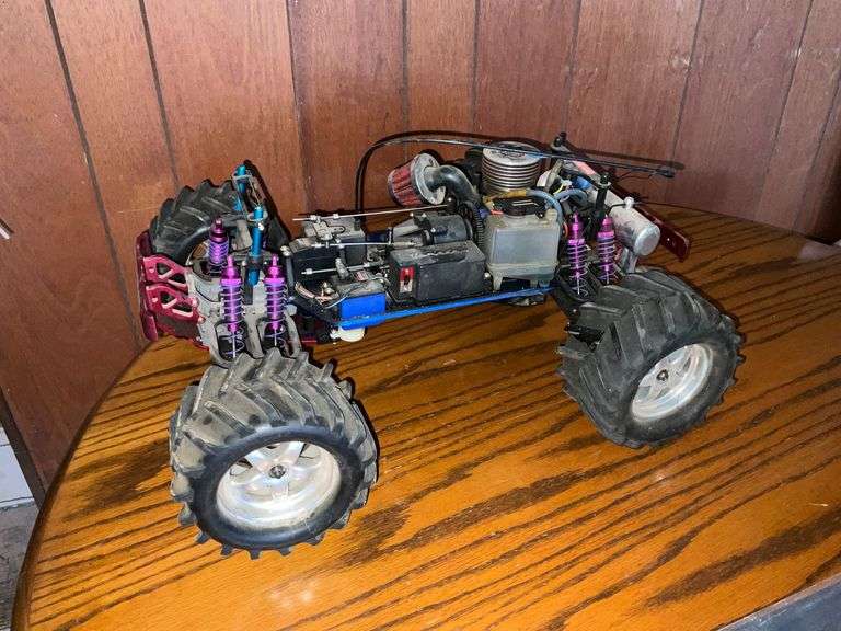Traxxas gas-powered monster truck chassis with engine and radio receiver image