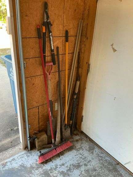Long handled tools, broom, sharp shooter, rock bar image