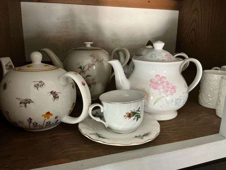 Teapots, cups and saucers image