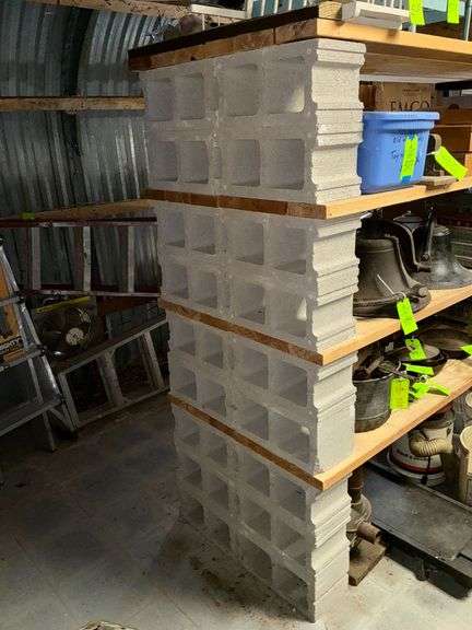 Wood and cinder block shelving, CONTENTS NOT INCLUDED image