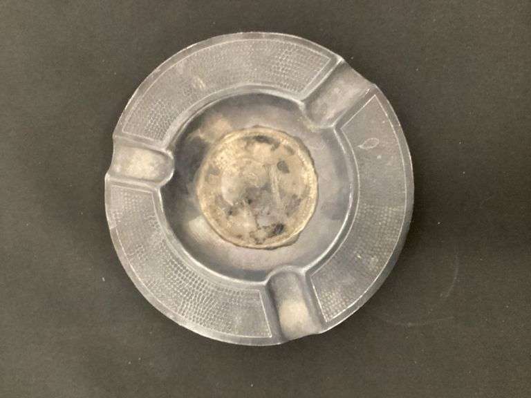 Vintage Chinese coin in ashtray image