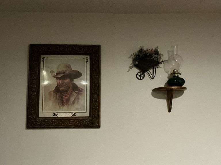 Framed cowboy print, wall art, shelf and oil lamp image