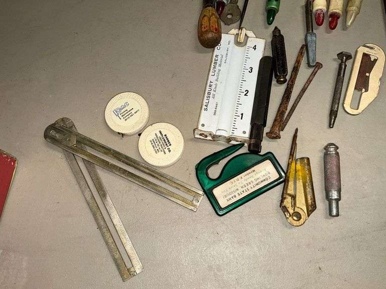 Railroad tie nails, plastic bottle openers image