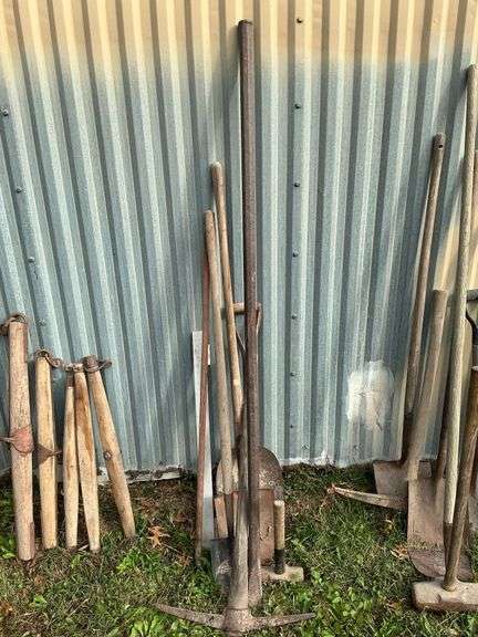 Long handled tools, shovels, rock bar image