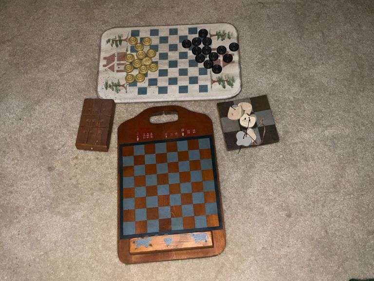 Wooden checker boards, tic tac toe, marble game. image