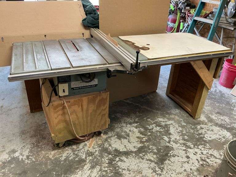 Delta Model 10 contractor's saw with hand made add-on table with casters image