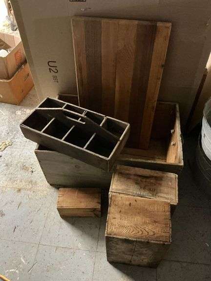 Wooden boxes, some with advertising image