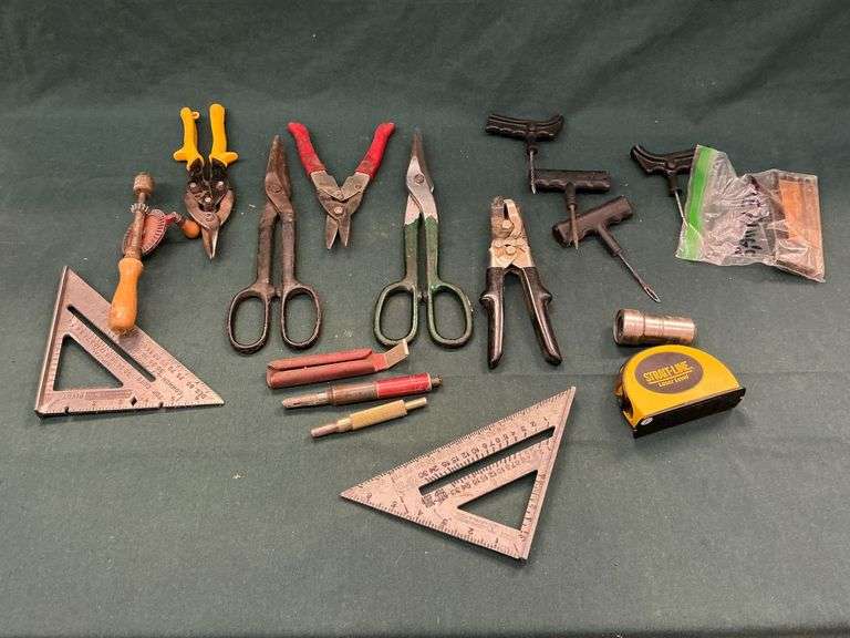 Tin snips, combination squares, tire patching tools, laser level, etc. image