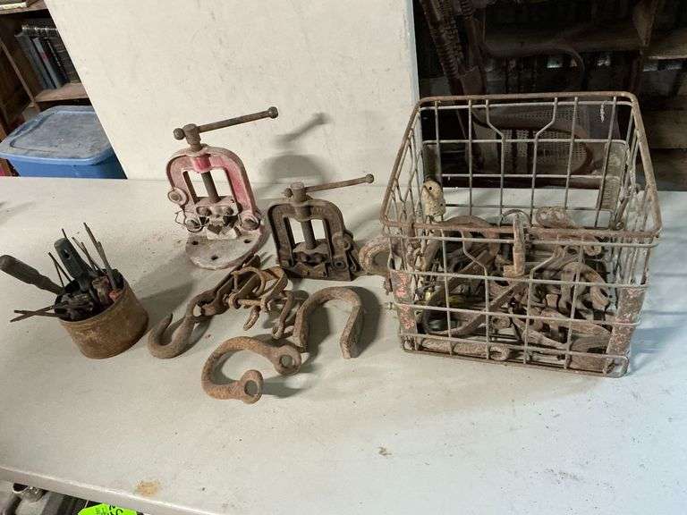 Metal milk crate, pipe vises image