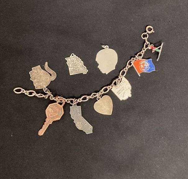 7" sterling silver charm bracelet, most charms are sterling image