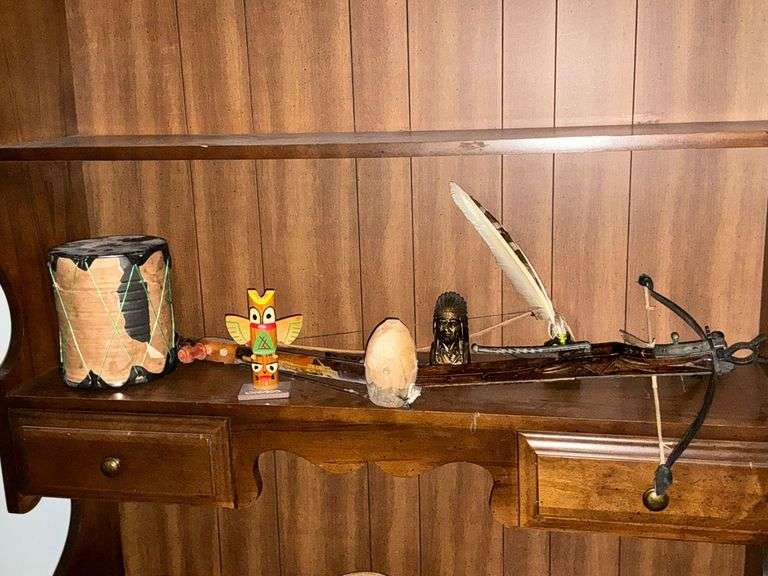Native American items, drum totem pole, figurines, cross bow, etc. image