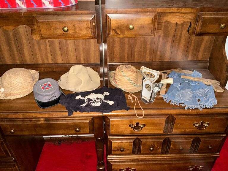 Cap gun and holster, wooden toy guns, cowboy hat, leather vest, etc. image