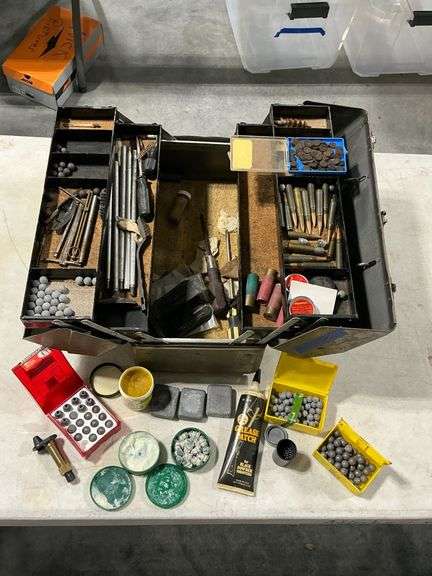 Metal tool box with black powder accessories image