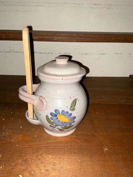 Pottery olive pot with wooden tongs image