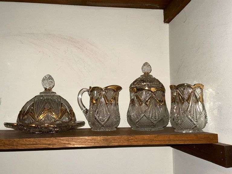 Cut glass pieces with gold accent image