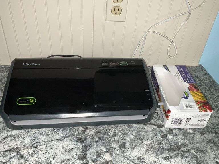 Foodsaver vacuum sealer and a few bags image