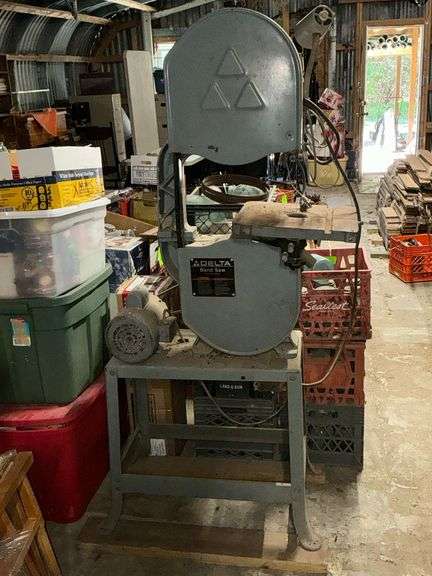Delta band saw on stand with light image