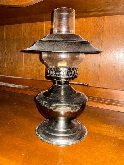 Oil lamp with metal base and shade image