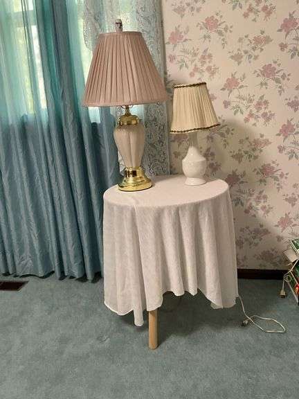 Pair of lamps on pressed wood table image