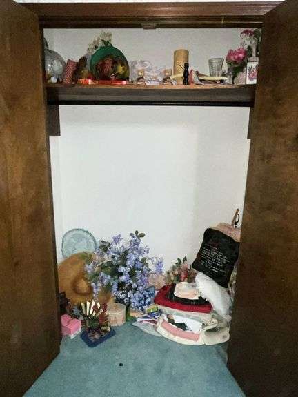 Closet full of decorative items, candles, table linens, image