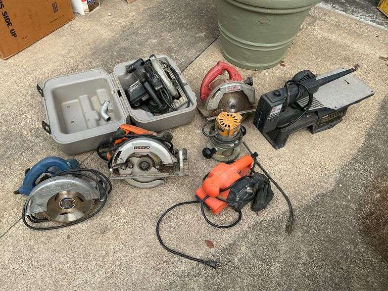 Tub of non-working power tools image