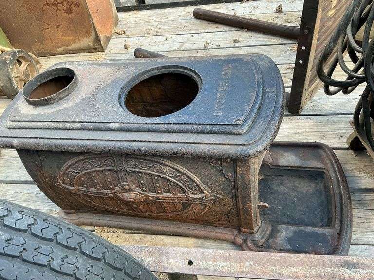 Comstock cast iron stove, no top or legs, or door. image