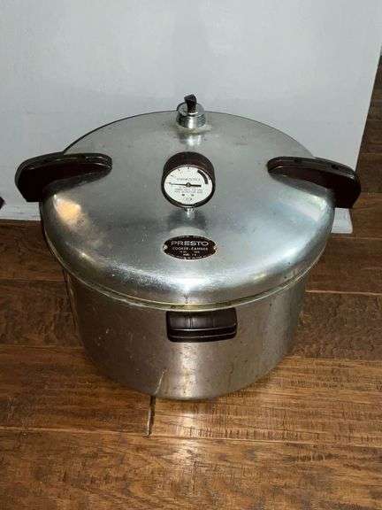 Presto pressure cooker with weight and racks inside image