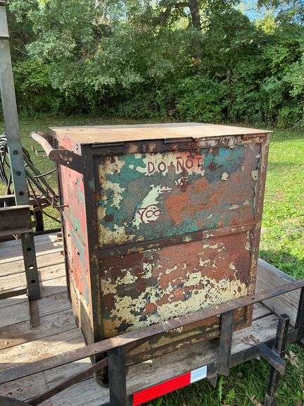 Metal cabinet on casters with contents image