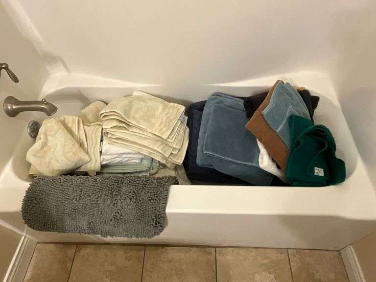 Bath towels, bath mat, pillows, sheets image