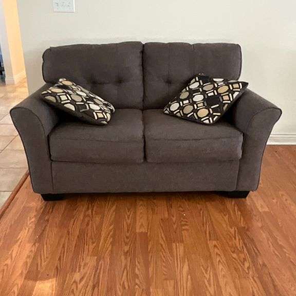 Ashley Furniture upholstered love seat with throw pillows image