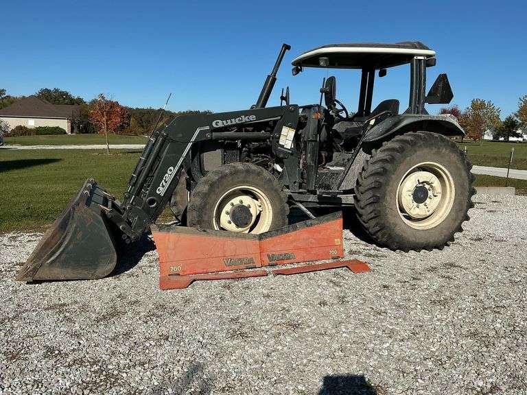Valtra 700 4WD tractor with Quicke Q720 loader with joystick and attachments image