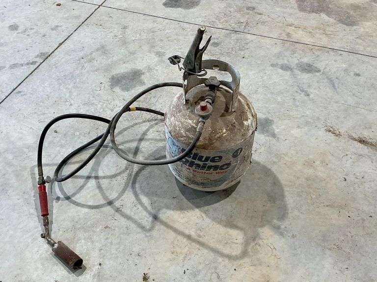 Weed burner and empty propane tank image