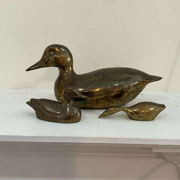 Trio of brass ducks image
