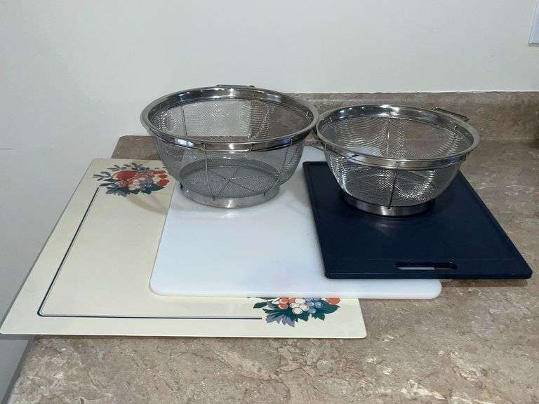 Stove and counter mats, cutting boards, pair of stainless strainers image